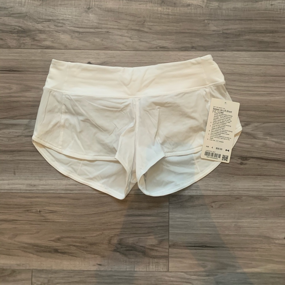 White LuluLemon Speed Up shorts 2.5”, size 4